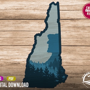 May include: A blue silhouette of the state of New Hampshire with a forest scene inside. The silhouette is on a woodgrain background. The text "LASER CUTTING FILE" is in a red circle at the top right of the image. The text "SVG PDF DIGITAL DOWNLOAD" is at the bottom of the image. The text "OCEANS APART GRAPHIC DESIGN" is in a circle at the bottom right of the image.