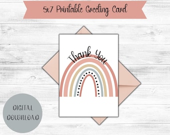 May include: Printable thank you card featuring a rainbow with pastel pink, beige, and gray colors. The rainbow has black polka dots and the text "Thank You" is written in black.