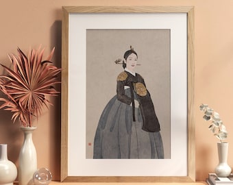 May include: A framed illustration of a woman wearing a traditional Korean hanbok dress. The woman is standing with her hands clasped in front of her. The background is a light beige color.