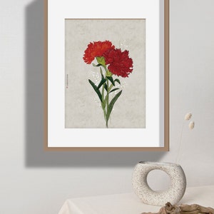 May include: A framed print of a botanical illustration featuring two red carnations with green stems and leaves against a light beige background.