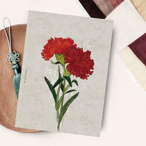May include: A print of two red carnations with green stems and white flowers on a light gray background.