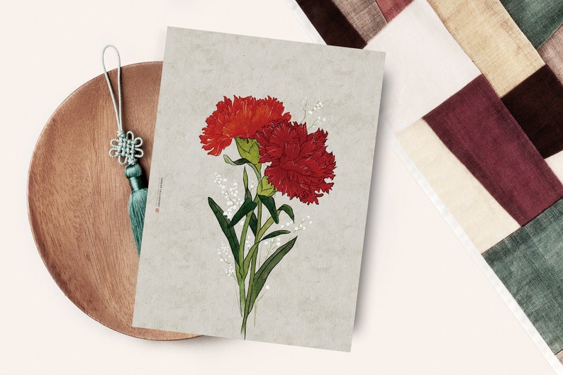 May include: A print of two red carnations with green stems and white flowers on a light gray background.