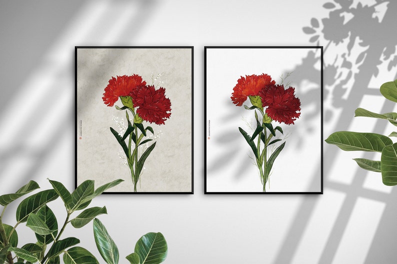 May include: Two framed prints of red carnations with green stems and white flowers in the background. The print on the left has a beige background and the print on the right has a white background.