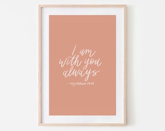 May include: A peach-colored printable art print with white calligraphy that reads "I am with you always" and "Matthew 28:20".
