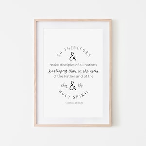 May include: A black and white printable wall art print with a religious quote from the Bible: "Go therefore and make disciples of all nations, baptizing them in the name of the Father and of the Son and of the Holy Spirit." Matthew 28:18-20