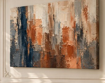 May include: A large rectangular canvas painting featuring an abstract composition of thick, textured brushstrokes in shades of deep navy blue, burnt orange, cream, and slate gray, displayed horizontally on a light-colored wall.