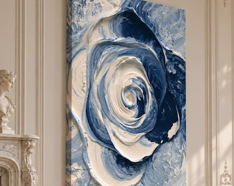 May include: A rectangular canvas wall art piece featuring a thick, impasto oil painting of a large, swirling rose. The artwork uses a palette of deep navy blue, sky blue, and crisp white, with visible, raised brushstrokes creating a textured effect.