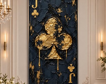 May include: A rectangular wall art piece featuring a textured dark navy blue background with a large, central gold leaf clover symbol. The letter J is positioned in the top left and bottom right corners, with smaller gold clover icons nearby.