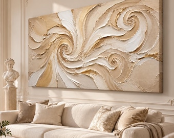 May include: A large rectangular wall art piece featuring thick, textured impasto paint in shades of cream, beige, and metallic gold. The composition displays swirling, spiral patterns that create a sense of movement across the canvas surface.