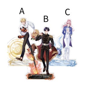 May include: Three acrylic standees featuring anime-style characters. The characters are dressed in various outfits, including military-style jackets and formal attire. Each standee has a unique design, with vibrant colors and detailed artwork. The background is white.