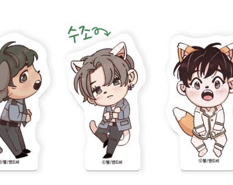 May include: Three cartoon stickers featuring characters with animal ears. The first sticker is a light brown dog with a blue shirt and gray pants. The second sticker is a gray cat with a blue shirt and gray pants. The third sticker is a fox with a white shirt and gray pants. The stickers have Korean text on them.