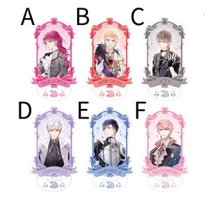May include: Six acrylic character stand-ups featuring anime-style characters with different colored hair and outfits. Each stand-up has a decorative frame and a banner with the character's name. The characters are:  Percival, Calixte,  Ucklies, Winter, Derrick, and Reynald.