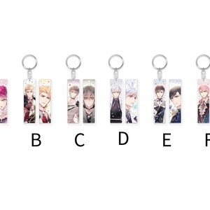 May include: Six different keychains with colorful anime characters on them. Each keychain has two characters on it. The keychains are labeled A through F.
