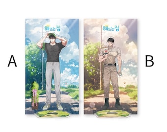 May include: Two acrylic standees featuring characters from the Korean webtoon "Haebitgan". The standees are printed with a colorful background and feature the characters in different poses. The text "Haebitgan" is printed at the top of each standee.