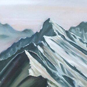 May include: A painting of a mountain range with snow-capped peaks. The mountains are painted in shades of green and white, with a soft, hazy background.