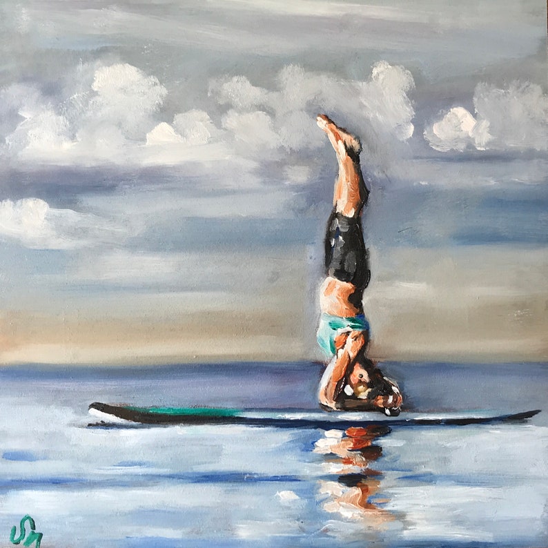 May include: A painting of a person doing a handstand on a paddleboard in the water. The sky is cloudy and the water is a light blue.