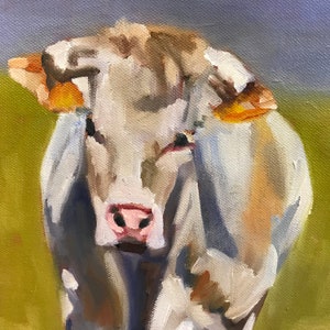 May include: A close-up painting of a white cow with brown markings. The cow is looking directly at the viewer with a soft expression. The painting is done in a realistic style with visible brushstrokes.