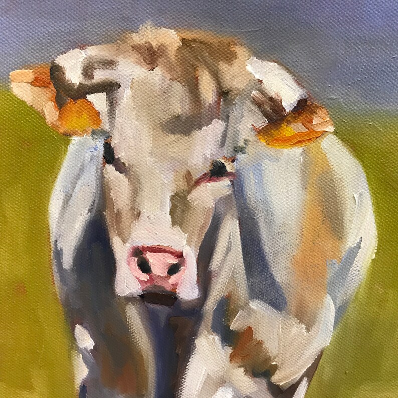 May include: A close-up painting of a white cow with brown markings. The cow is looking directly at the viewer with a soft expression. The painting is done in a realistic style with visible brushstrokes.