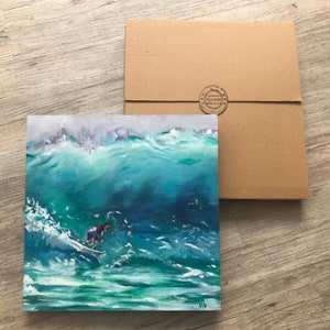 May include: A painting of a surfer riding a large wave. The wave is a vibrant blue-green color, and the surfer is wearing a red and blue wetsuit. The painting is framed and ready to hang.
