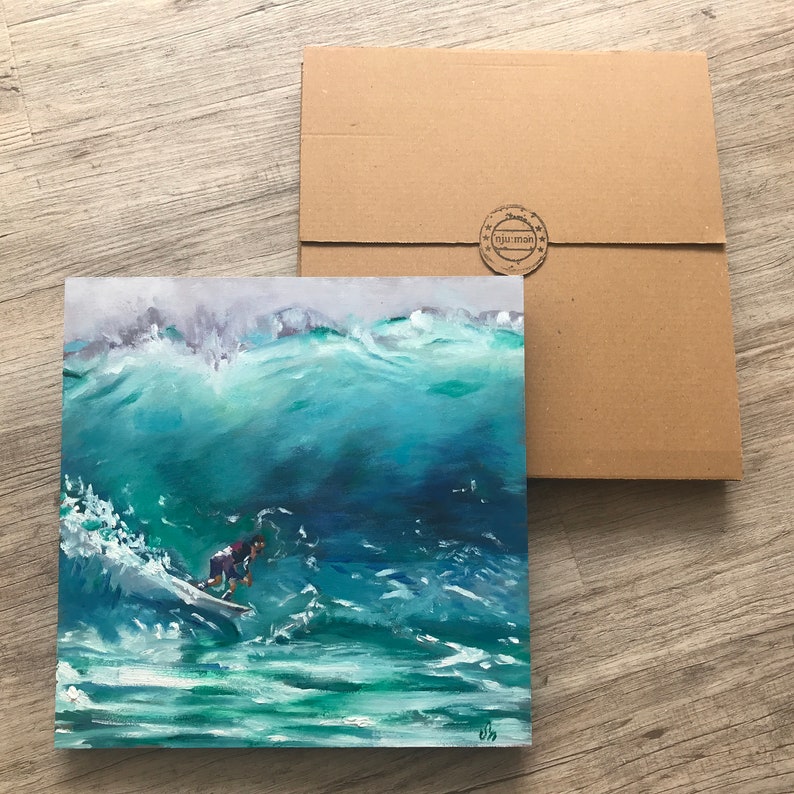 May include: A painting of a surfer riding a large wave. The wave is a vibrant blue-green color, and the surfer is wearing a red and blue wetsuit. The painting is framed and ready to hang.
