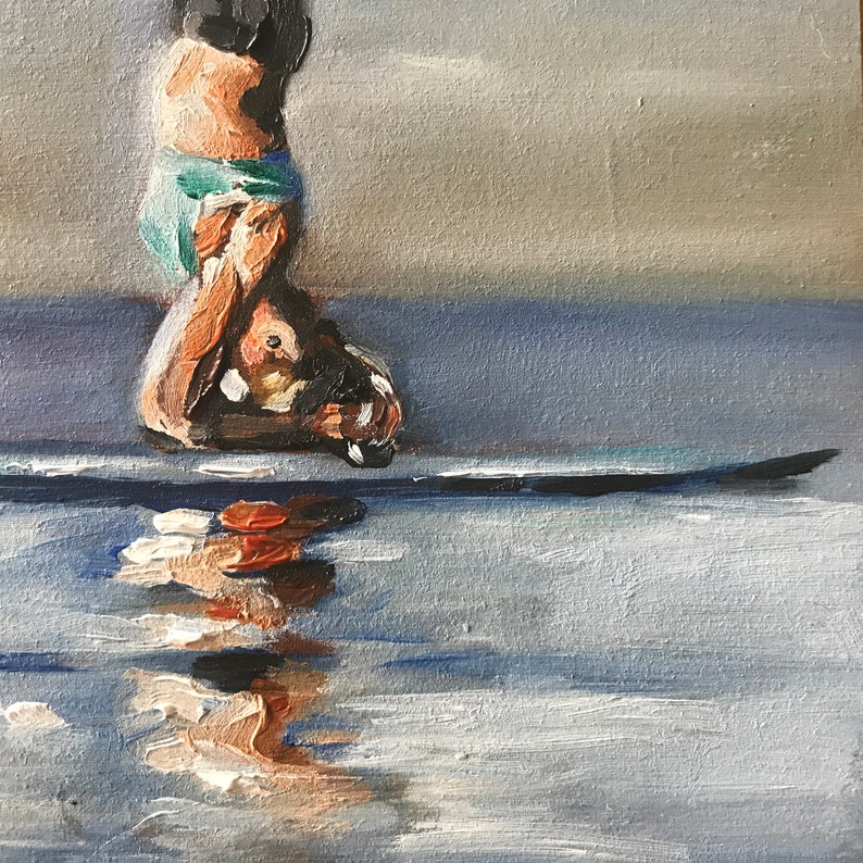 May include: A painting of a person in a blue and green swimsuit, standing on a surfboard in the water. The person's reflection is visible in the water.