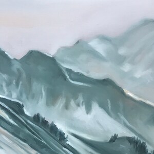 May include: A painting of a mountain range with a misty, hazy sky. The mountains are painted in shades of blue and gray, with hints of white snow.