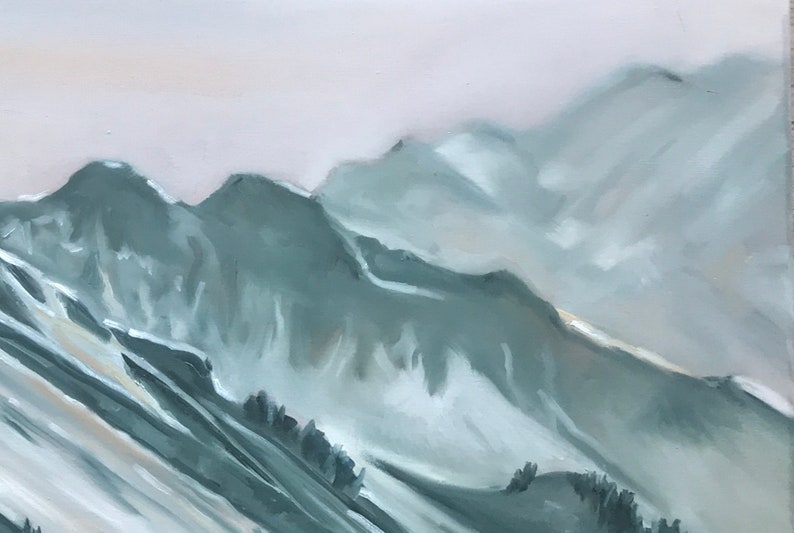 May include: A painting of a mountain range with a misty, hazy sky. The mountains are painted in shades of blue and gray, with hints of white snow.