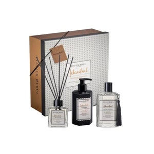 May include: A gift set featuring a black and white box with a white and gray patterned design. The box contains a black bottle of hand soap, a clear bottle of body spray, and a diffuser with black sticks. All bottles have a black and white label with the text "Atelier Rebul Istanbul" and a decorative tassel.