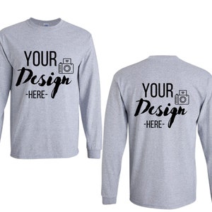 May include: A gray long-sleeve t-shirt with the text "YOUR Design -HERE- " and a camera graphic on the front and back.
