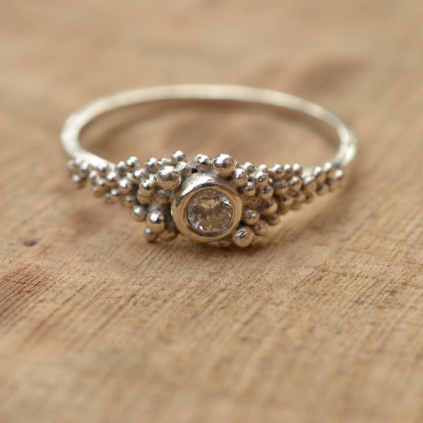 Sterling silver ring with clear cubic zirconia and granulation