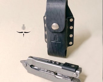 May include: A black leather multi-tool pouch with a silver snap closure and a silver logo. A silver multi-tool with a black handle is shown next to the pouch.