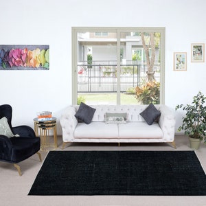 5.4x9 Ft Plain Black Area Rug, Handknotted and Handwoven in Turkey, Ideal for Modern Interiors. NTEK1075