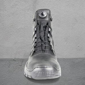 May include: Black tactical boot with a high-top design. The boot features a lace-up closure system with metal eyelets and a round dial at the top. The sole is textured for grip, and the boot is made of durable materials.