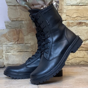 Close-up of Scorpion Plus tactical boots — reinforced heel and deep tread non-slip sole designed for rough terrain and daily outdoor use