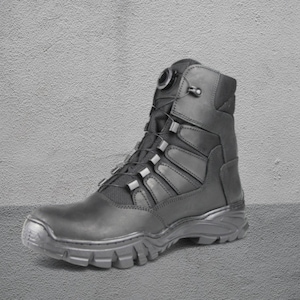 May include: Black tactical boot with a high-top design. The boot features a rugged sole, a lace-up closure system, and reinforced panels. The boot is made of durable materials and is suitable for outdoor activities. The boot is approximately 8 inches tall.