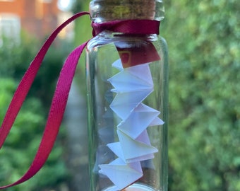 Miniature bottle bauble with tiny concertina book inside