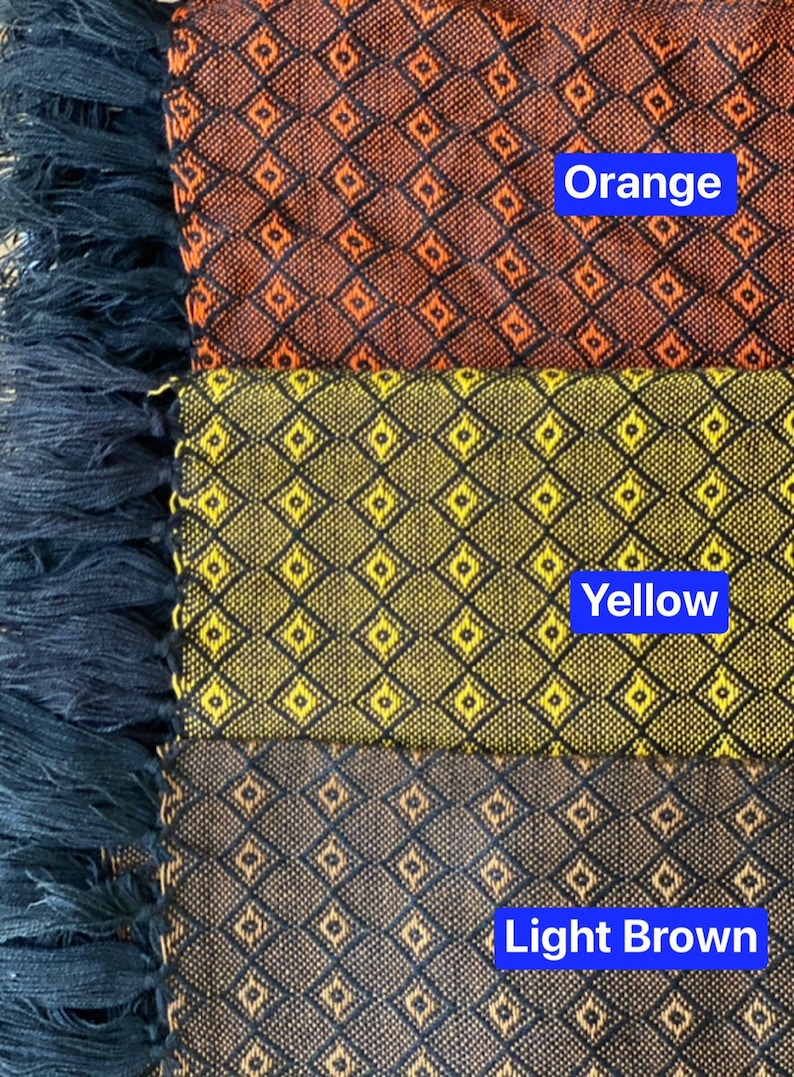 May include: Three fabric swatches with a diamond pattern. The top swatch is orange, the middle swatch is yellow, and the bottom swatch is light brown.