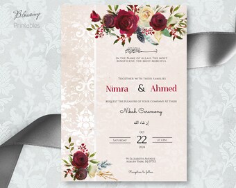 Könnte beinhalten: Eine Hochzeitseinladung mit einem floralen Design mit roten und weißen Blumen. Die Einladung ist für eine Nikah-Zeremonie für Nimra und Ahmed am 22. Oktober 2024 um 16:00 Uhr. Die Adresse lautet 95 Elizabeth Avenue, Asbury Park, NJ 07712.