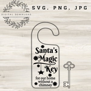 May include: Black and white door hanger with the text "Santa's Magic Key for our home without a chimney". A decorative key is shown to the right of the door hanger.