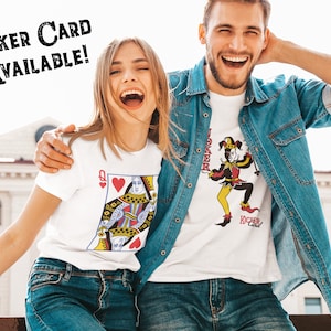 May include: Two white t-shirts featuring playing card graphics. One shirt displays a Queen of Hearts design, while the other shows a colorful jester illustration with the text JOKER and KICKER CARD. The image includes the text JOKER CARD AVAILABLE!