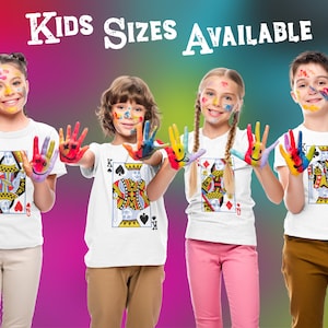 May include: Four white t-shirts featuring playing card graphics of a Queen of Hearts, King of Spades, Queen of Diamonds, and King of Clubs. The text KIDS SIZES AVAILABLE is printed at the top. Each shirt displays a unique royal card illustration.