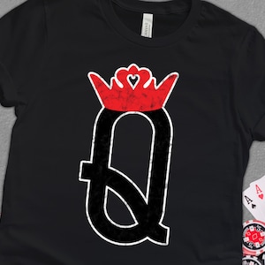 May include: Black t-shirt with a red and white queen of hearts playing card graphic. The graphic is distressed and has a vintage look.