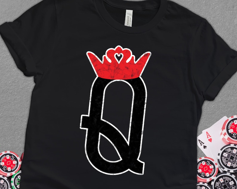 May include: Black t-shirt with a red and white queen of hearts playing card graphic. The graphic is distressed and has a vintage look.
