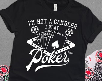 May include: Black t-shirt with white text that reads "I'm not a gambler I play Poker" with a graphic of playing cards and poker chips.