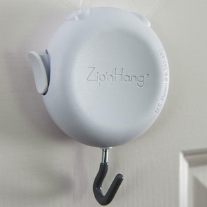 ZipnHang: Adjustable over-the-door hanger for wreaths and decor. Fits standard, glass, storm and screen doors — no damage, easy setup!