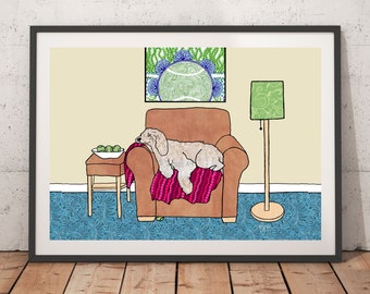 May include: A beige dog is sleeping on a brown armchair with a pink blanket. The armchair is in a room with a green lamp, a side table with a bowl of green apples, and a framed picture of a green and blue tennis ball.