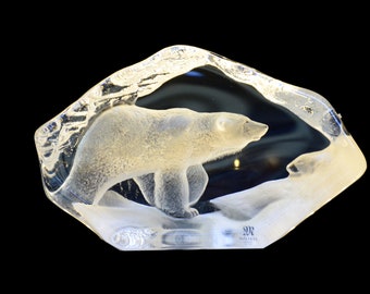 May include: A clear glass sculpture of a polar bear walking on a snowy surface. The sculpture is made by the company "R.H.  Antikas".
