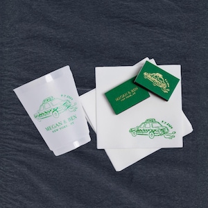 A collection of custom printed wedding favors featuring a green taxi design. Includes a frosted plastic cup, green matchboxes, and white cocktail linen textured napkins. The text within each of the designs and products is personalized  with "Megan & Ben, New York, NY" and the date "9.7.2024".