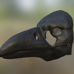 May include: A black crow mask with a textured surface and a large beak. The mask has eye holes and a hole on the side for the wearer's ear.