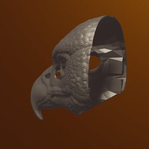 May include: A gray 3D printed mask of a bird's head, with a detailed textured surface and a hollow interior. The mask is designed to be worn over the face.